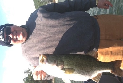 Client Terry Johnson with a 9.1 largemouth caught last Friday using a Carolina Rig in 10 ft with scattered grass.