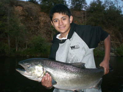 Andrian, with his first King salmon-Trinity River- Guide & Captain Kirk Portocarrero August 15,2009